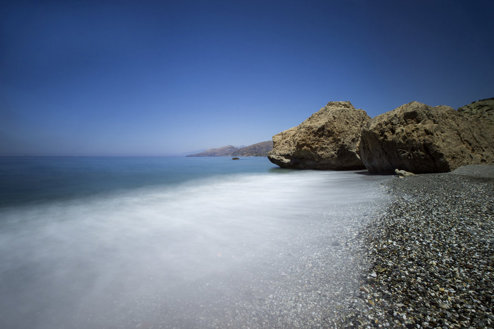 Ligres Beach with a dramatic rock headland