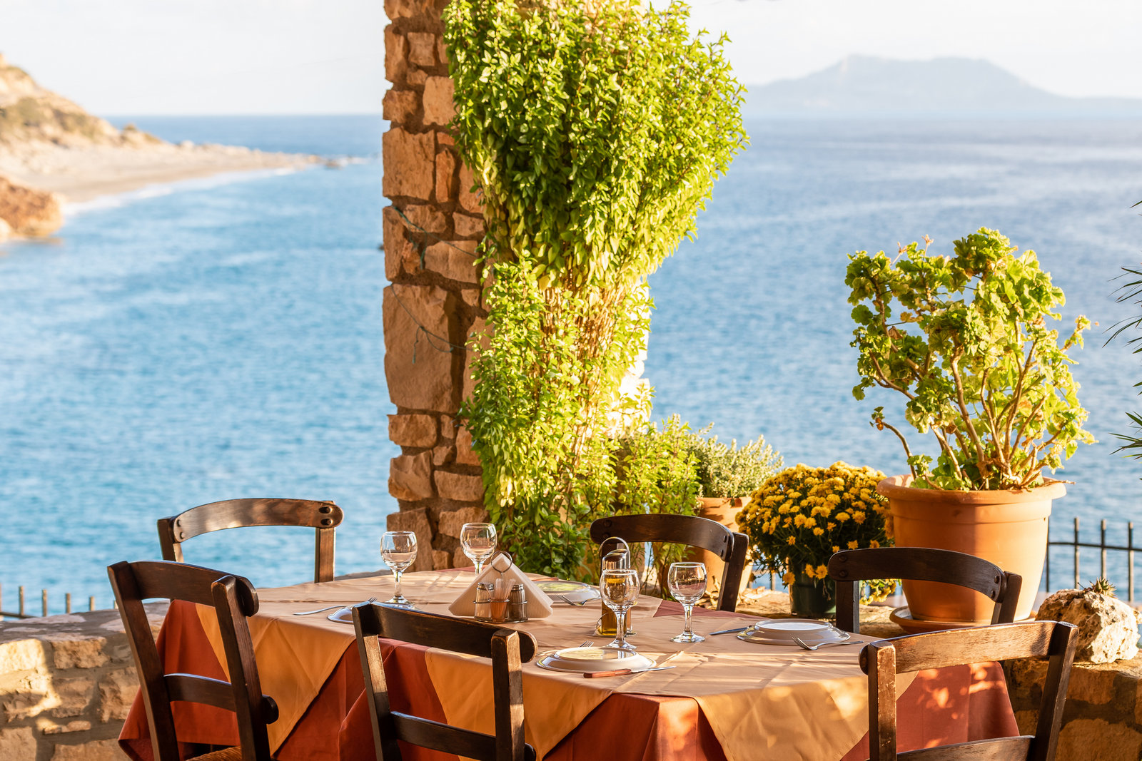 Restaurant terrace table set above the sea